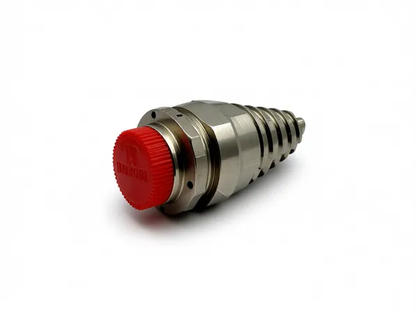 Close up detail of taper screw nozzle internal threading and finish for industrial equipment use.